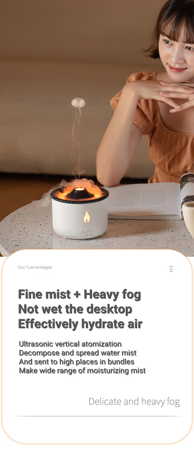White ultrasonic essential oil diffuser with orange flame effect mist, alongside a gift set of Lavender, Peppermint, Tea Tree, and Sweet Orange essential oils. - Image 12