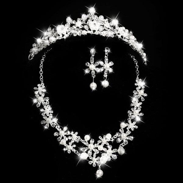 Bridal jewelry set with a silver-tone necklace and matching drop earrings, featuring crystal flowers and faux pearls.