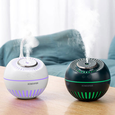 Dark green spherical humidifier with a textured top, control icons, and "HUMIDIFIER" printed on its side.