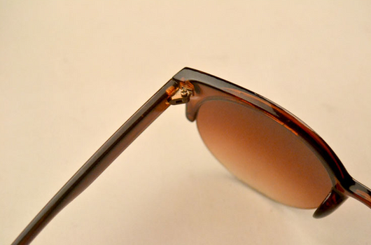 Half frame cat eye retro sunglasses with brown gradient lenses and a tortoiseshell-patterned frame. - Image 4