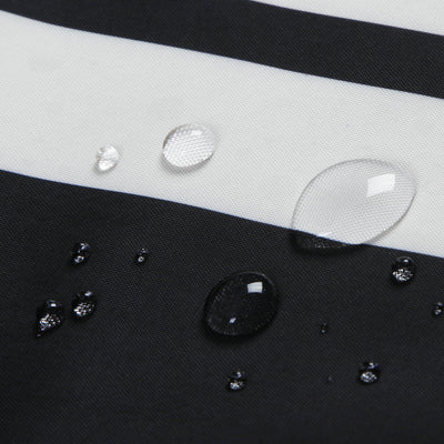 Black and white striped polyester shower curtain with a crown and text design, hanging from a silver tension rod. - Image 4