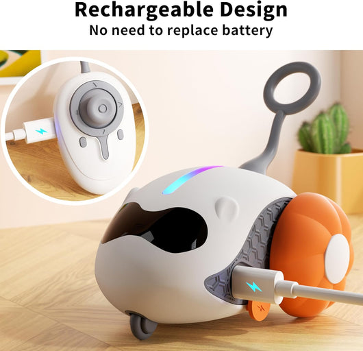 Interactive cat toy with white robotic base, orange wheels, and feather attachment, controlled by a remote, with a cat looking on. - Image 6
