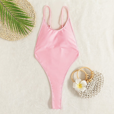 Light pink one-piece swimsuit with thin spaghetti straps and a high-cut leg design, worn by a woman. - Image 14