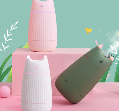 Pink cat-shaped humidifier with pointed ears and a ribbed texture on the lower body, ideal for desktop use. - Image 5