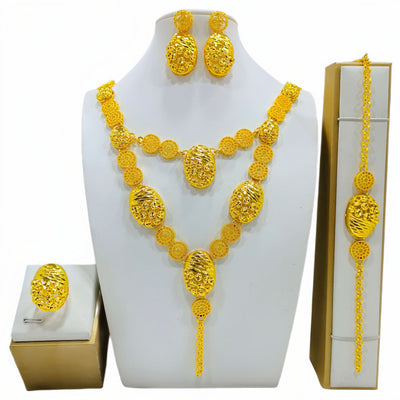 Gold-colored fashion jewelry set with a two-layer necklace, drop earrings, bracelet, and ring, all featuring intricate leaf and floral filigree designs. - Image 3