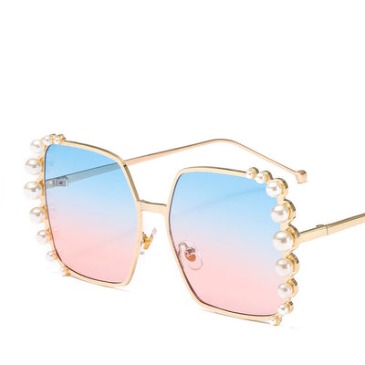 Oversized hexagonal sunglasses with gold-tone metallic frames, light pink lenses, and faux pearl embellishments. - Image 5