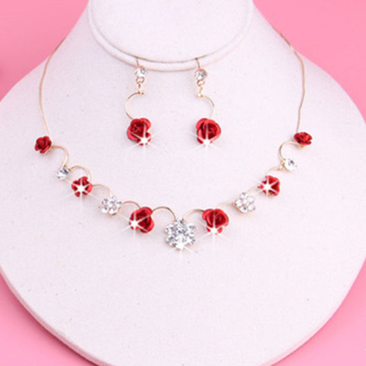 Red rose and clear crystal necklace and matching earrings set on a white jewelry bust, with a pink background. - Image 6