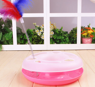 Interactive cat toy with a yellow and white circular ball track base and a spring-mounted feather wand. - Image 3