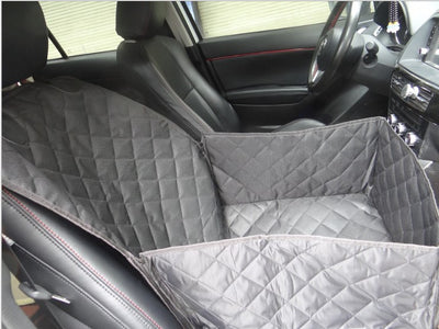 Black quilted pet car seat cover installed on a front passenger seat, protecting the upholstery. - Image 4