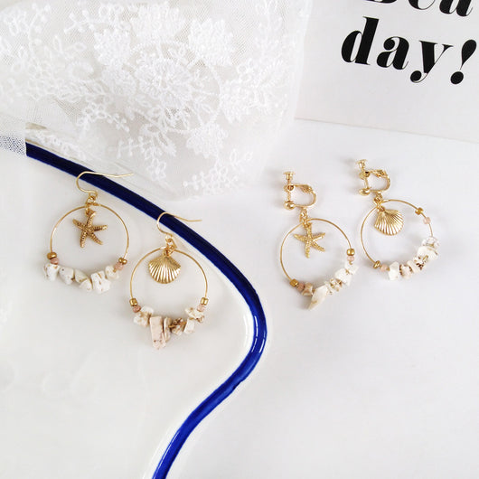 Aretes Estrella de Cinco Puntas en Metal Salvaje con Concha Marina - Image 4
