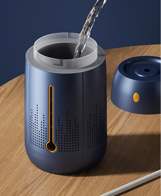 White cylindrical household humidifier with a visible water level indicator, next to its brown cardboard packaging. - Image 13
