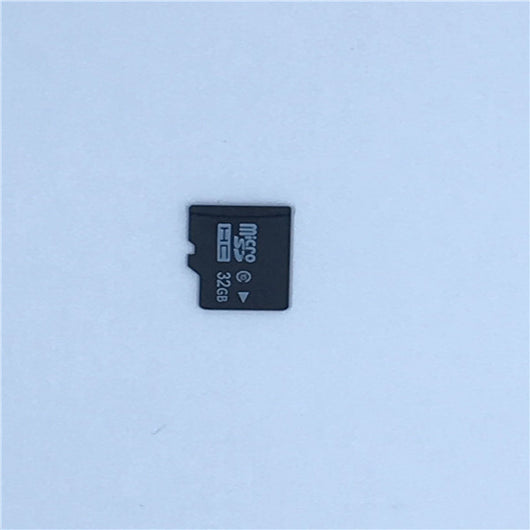 White A9 WIFI wireless network camera with a black lens, shown next to a black 32GB microSD card. - Image 9