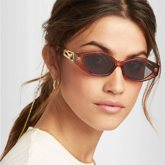 Angular cat-eye sunglasses with a tortoiseshell frame, brown gradient lenses, and gold jumping cheetah temple details. - Image 2