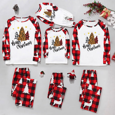 Matching family Christmas pajamas in red and black plaid with "Merry Christmas" text, tree, and reindeer prints. - Image 4