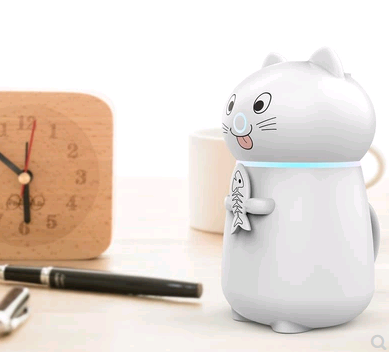 White cartoon cat humidifier with a pink tongue, black eyes, and whiskers, holding a fish skeleton, with a glowing blue light band. - Image 5