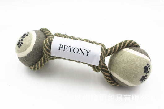 Braided rope dog chew toy with two tennis balls featuring paw prints, shown with a dog holding a similar toy. - Image 4
