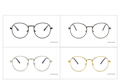 Black round anti-blue light glasses with clear lenses showing a blue reflection, resting on a gray textured surface. - Image 7