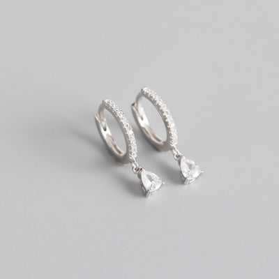 Silver-colored hoop earrings with black pave stones and dangling black teardrop-shaped stones. - Image 10