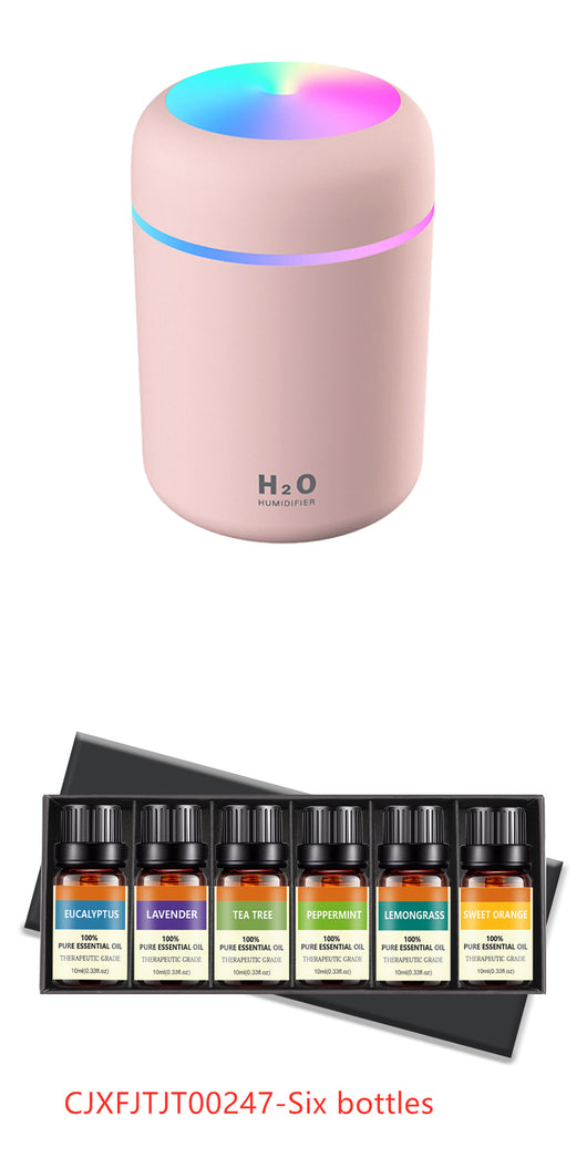Pink ultrasonic aromatherapy essential oil diffuser with a colorful LED light band and top light, labeled H2O Humidifier. - Image 9