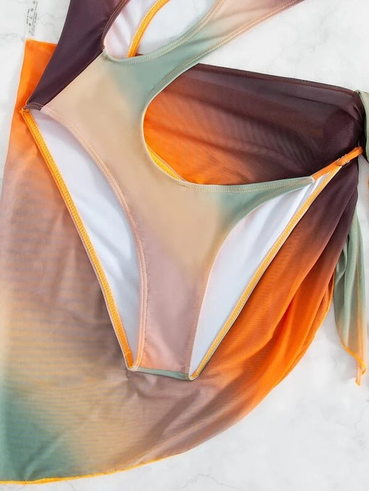 Ombre one-piece swimsuit with a large torso cutout and a matching sarong tied at the hip. - Image 12