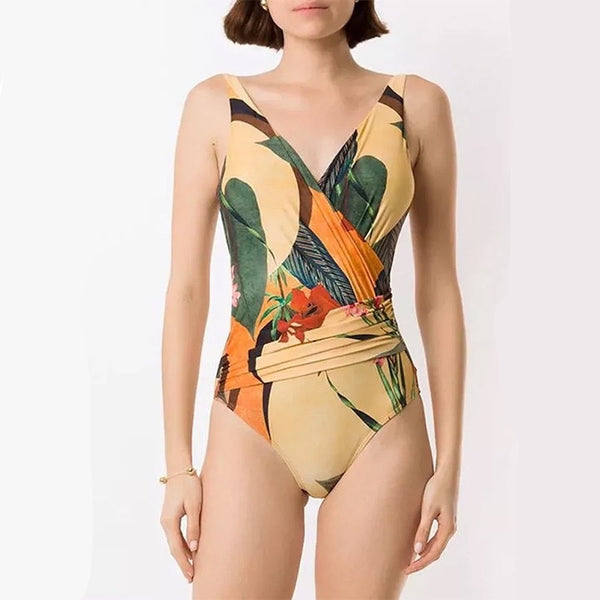 Two-piece tropical print swimsuit set with a V-neck one-piece and a matching long wrap skirt with tie waist.