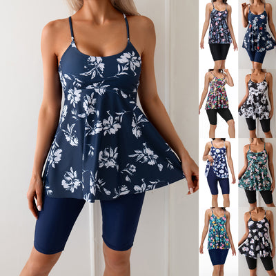 Women's navy blue two-piece swimsuit with white floral tankini top and matching solid swim shorts. - Image 2