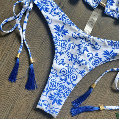 Women's blue and white porcelain print halter bikini with tie-side bottoms and blue tassels. - Image 3