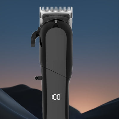 Black electric hair clipper with LCD display showing '100', multiple guide combs, cleaning brush, oil, comb, and USB cable.
