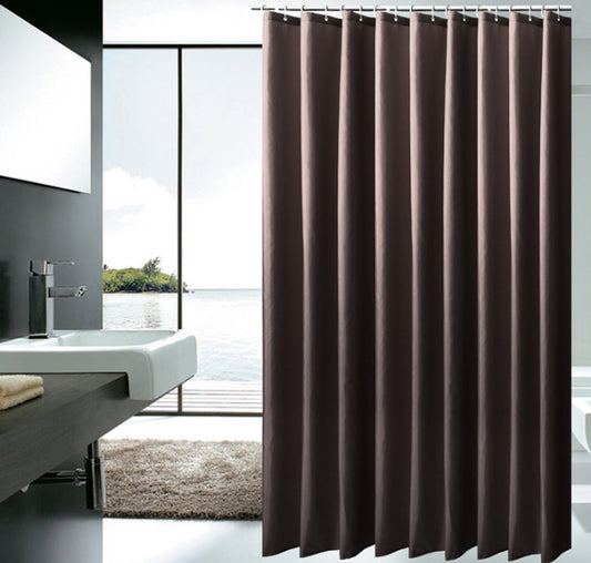 Solid brown polyester shower curtain with metal grommets and hooks, hanging from a silver shower rod.