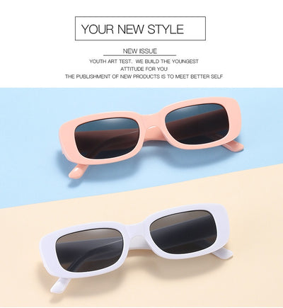 Children's small frame oval sunglasses with a solid white PC frame and brown AC lenses for UV protection. - Image 21