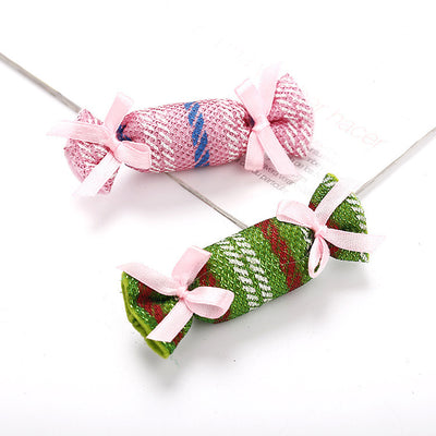 Six colorful fabric pet toys shaped like wrapped candies, featuring plaid, polka dot, and snowflake patterns. - Image 4