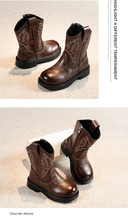 Girls' brown Martin boots with white ethnic embroidery, side zippers, and black soles, displayed on a light carpet. - Image 28