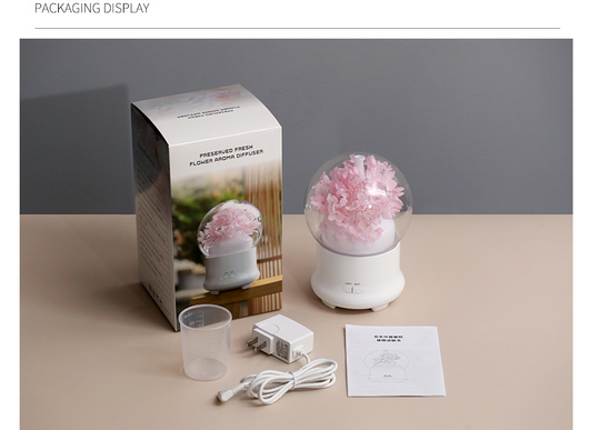 White aromatherapy machine with a clear dome top, featuring blue preserved flowers and an aqua glow. Includes 'LIGHT' and 'MIST' controls. - Image 8