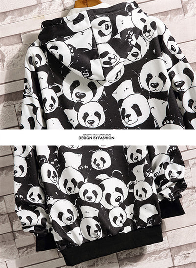 Mother and baby wearing matching black and white panda print pajamas, sitting together on a white bed. - Image 12