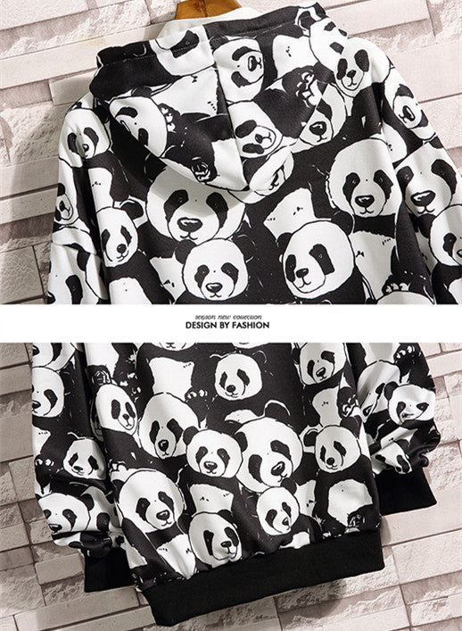 Mother and baby wearing matching black and white panda print pajamas, sitting together on a white bed. - Image 12