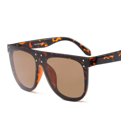 Black and white flat top sunglasses with dark lenses and small gold-toned stud details on the frame. - Image 10