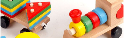 Wooden toy train with a locomotive and two carriages, each carrying colorful shape-sorting blocks. - Image 5