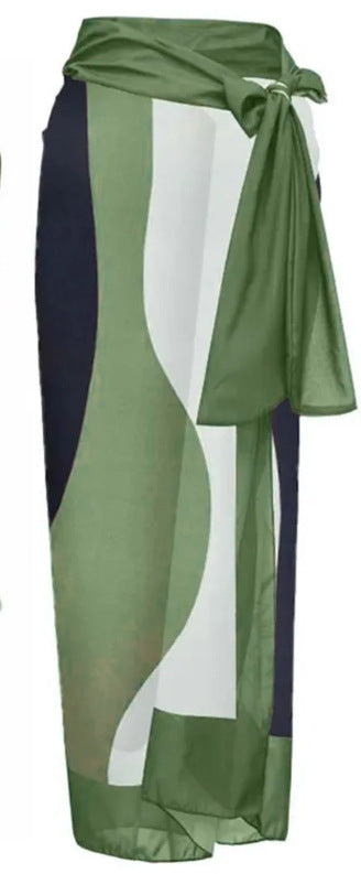 Green and white abstract wavy print one-piece swimsuit with matching sarong, offering conservative belly coverage. - Image 9