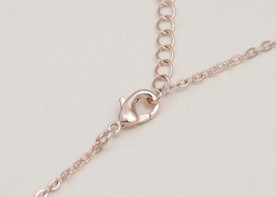 Rose gold-toned necklace and earring set with white pearls and clear rhinestones, ideal for bridal or formal wear. - Image 4