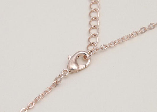 Rose gold-toned necklace and earring set with white pearls and clear rhinestones, ideal for bridal or formal wear. - Image 4