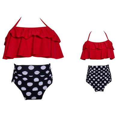 Black wrap bikini top with high-waisted pink and green tropical leaf print swim bottoms. - Image 5