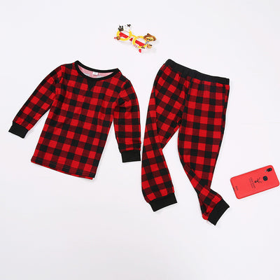 Red and black plaid long-sleeve family pajamas, including adult, child, and baby sizes, with festive accessories. - Image 3