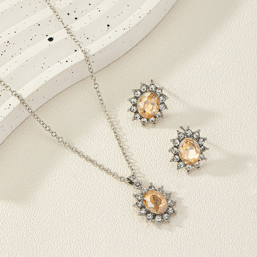 Iridescent teardrop pendant necklace with matching stud earrings, featuring clear accent stones and silver-tone metal. - Image 3