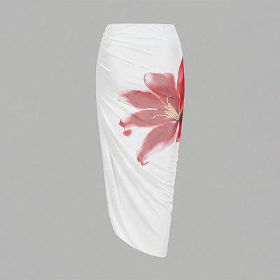 White one-piece swimsuit with red floral print and matching ruched sarong skirt for beach or resort wear. - Image 12