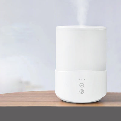 White cylindrical household humidifier with a translucent top section glowing blue, featuring two control buttons. - Image 3
