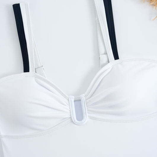 White one-piece women's swimsuit with black side panels and straps, featuring a ruched bust and U-shaped detail. - Image 37