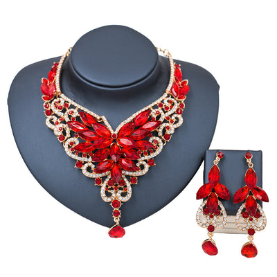 Exaggerated green gemstone necklace and matching dangle earrings set with gold-tone metal and clear accents. - Image 6