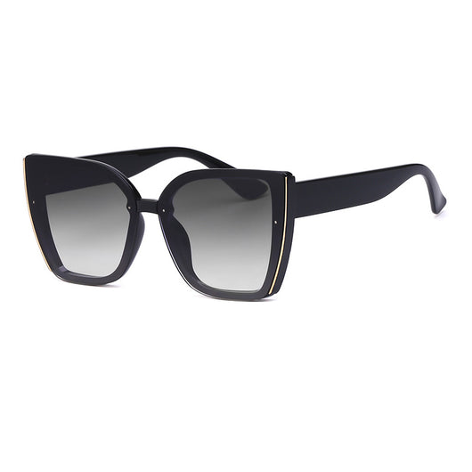 Women's black cat-eye sunglasses with large frames, gradient gray lenses, and gold-tone accents. - Image 11