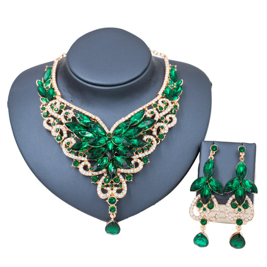 Exaggerated green gemstone necklace and matching dangle earrings set with gold-tone metal and clear accents. - Image 7