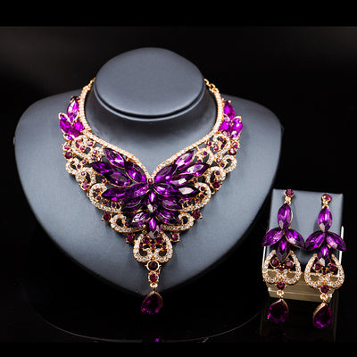 Exaggerated green gemstone necklace and matching dangle earrings set with gold-tone metal and clear accents. - Image 5
